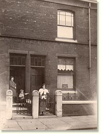 Paternal Gran at gate of authentically smoke-blackened terrace, down t'road from our own